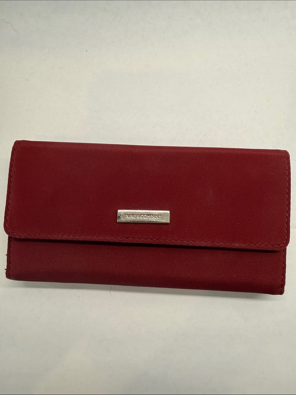 Nine & Co Burgundy Fold-Over Wallet with Metal Logo